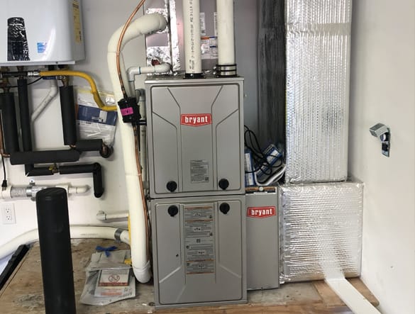 HVAC technician performing furnace repair in a Santa Rosa home